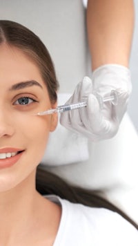 a woman getting a syringe injection